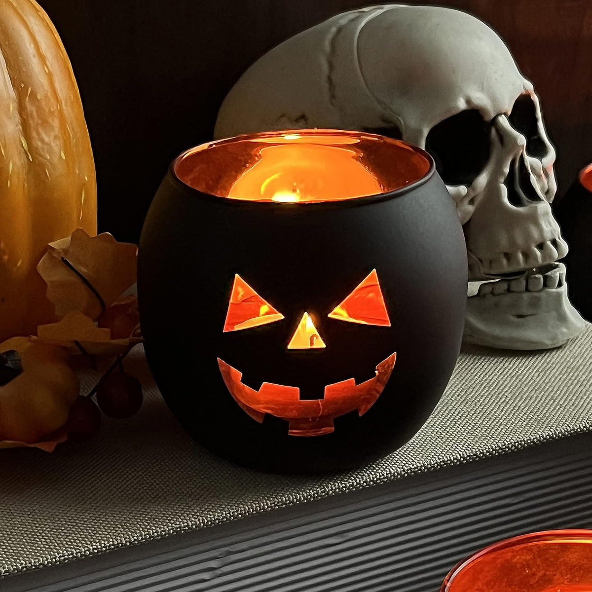 SHMILMH Halloween Table Centerpiece Candle Holders Set of 12, Black and Gold Glass Votive Holder with 6 Grimace, Tealight Holders Bulk for Halloween Party D?or